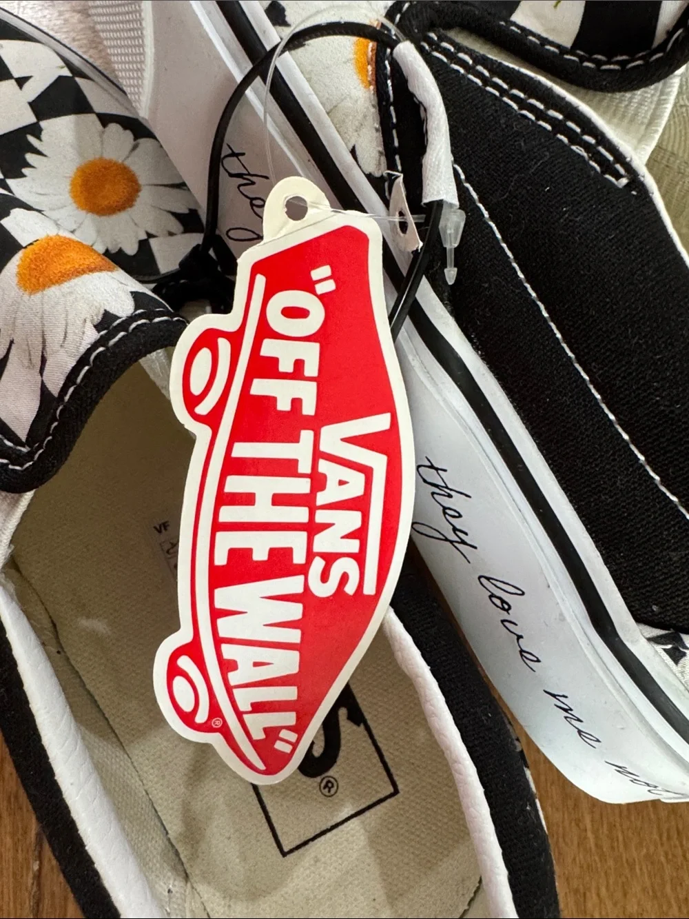 Vans Kids Slip-On Sneakers Black/White Daisy with Orange Centers